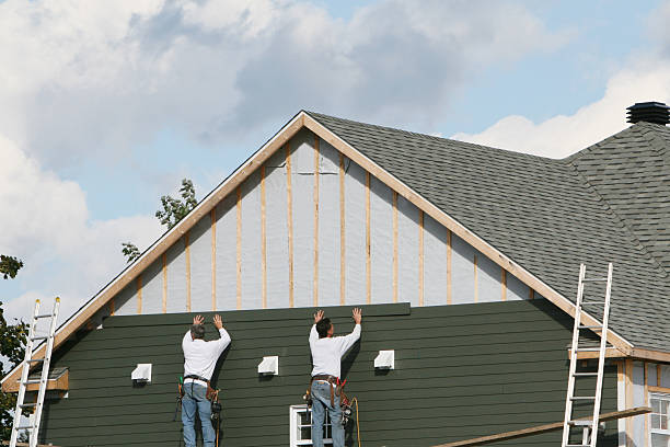 Professional Storm Damage Siding Repair technician working in Belmont, PA